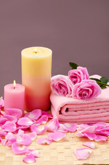 Obraz na płótnie Canvas spa set with rose and candle on mat