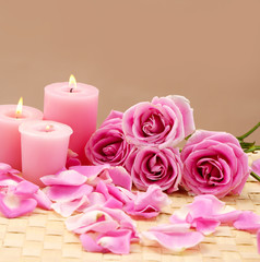 Fototapeta na wymiar spa set with rose and candle on mat
