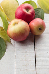 Fresh apples on wooden table