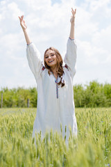 Young happy woman in traditional ukrainian dress