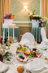Table with delicious food and drink in restaurant