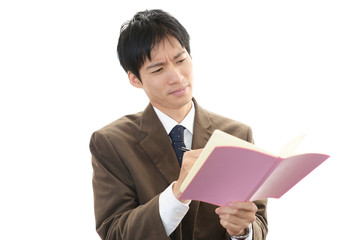 困った様子のビジネスマン