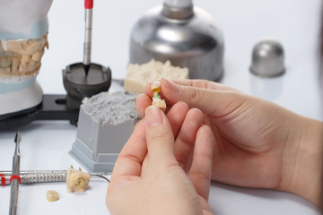 Dental technician working with articulator in dental laboratory © pixs4u