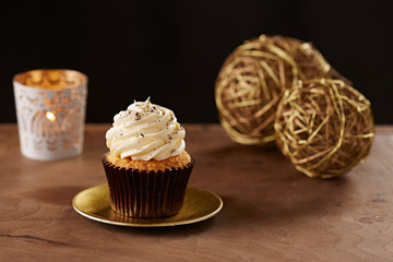 Vanilla cupcake on Christmas background