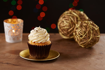 Vanilla cupcake on Christmas background