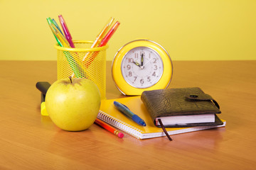 Exercise book, organizer and support with pencil