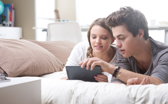 Young couple using digital tablet