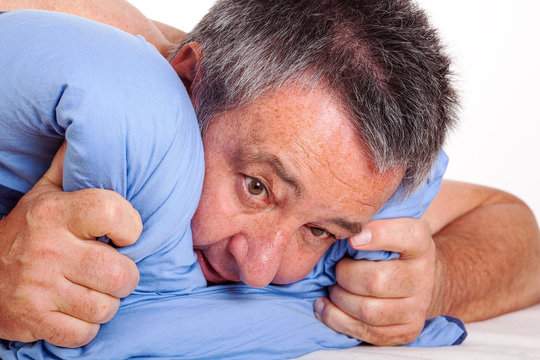 Man lying in bed and can not sleep