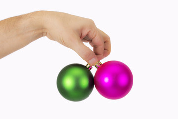 hands wth christmas ornaments