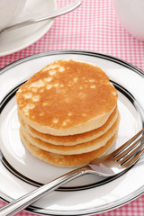 Stack of plain buttermilk breakfast pancakes