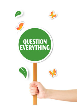 Hand holding green question everything sign