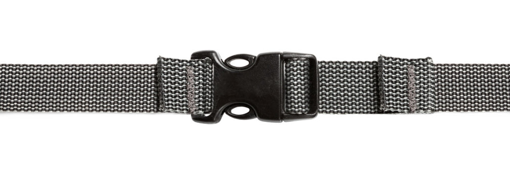 Black plastic buckle on strap isolated