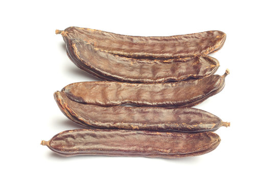Carob pods isolated on white