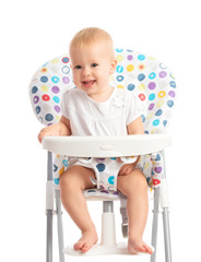 baby sitting in a high chair isolated