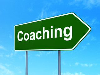 Education concept: Coaching on road sign background