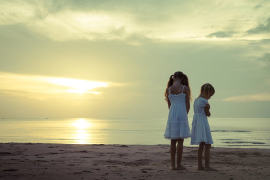 Sad Children On The Beach