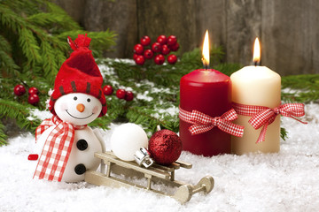 happy snowman with sleigh and candles