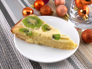 kiwi tasty cake with champagne wine bottle and christmas balls