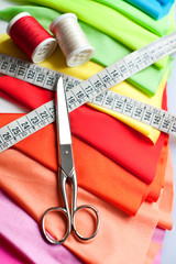 Example of Colorful fabric, scissors, meter and threads