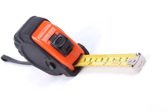 Closeup of a measuring tape on white background