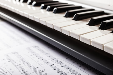 Sheet music and a piano keyboard