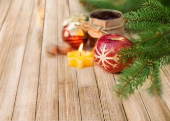 Christmas fir tree with decoration on a wooden board