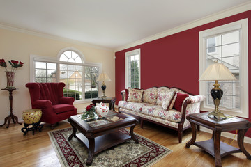 Living room with red and cream colored walls