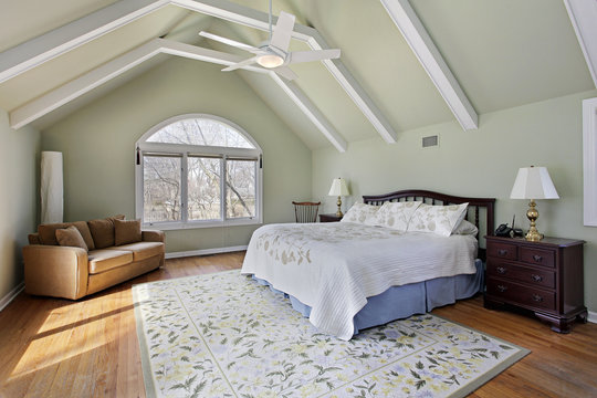 Master bedroom with ceiling beams