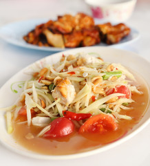 spicy papaya salad and roasting chicken
