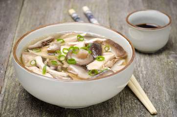 Chinese food - bowl of soup with chicken, shiitake mushrooms