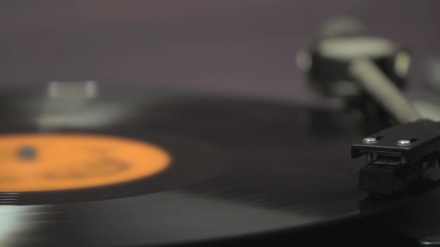 Detail of vintage record player with spinning vinyl