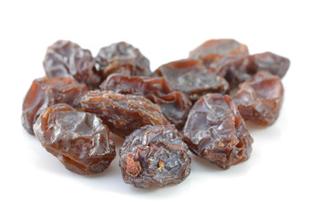 pile of raisins on white background