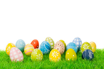 Easter egg variation on a meadow isolated on white.