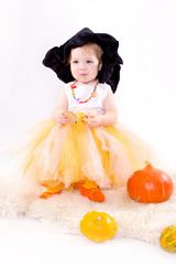 Baby with pumpkins