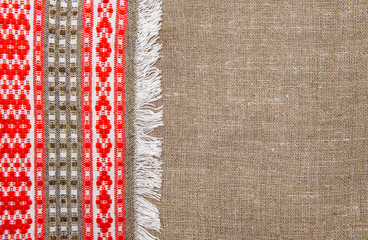Burlap background bordered by country cloth