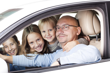 happy father with children in the car