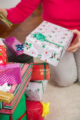 Senior Woman Sitting By Christmas Gifts