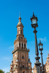 Fototapeta na wymiar Clock tower Seville Spain Plaza de Espana
