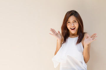 Fototapeta premium happy woman showing exciting positive expression with blank back