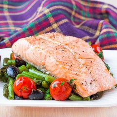 Fillet of red fish salmon with green beans, tomatoes, olives