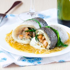 Fish rolls of dorado fillet stuffed shrimp and spinach, onion