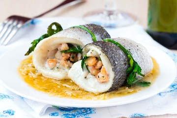 Fish rolls of dorado fillet stuffed shrimp and spinach, onion