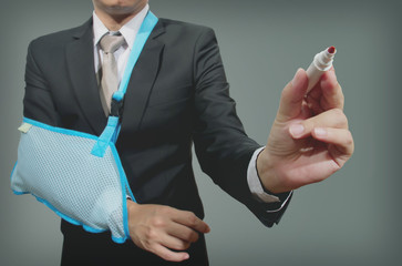 young businessman with broken hand wearing an arm brace, series