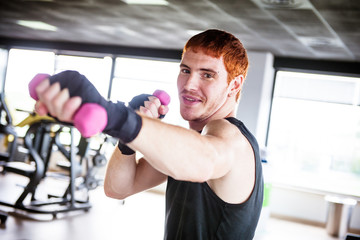 Happiness man doing exercise with weights