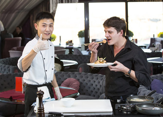 chef and the customer in a restaurant with Japanese food