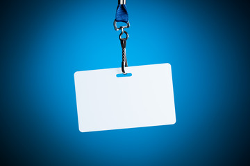 empty white badge backdrop against blue background