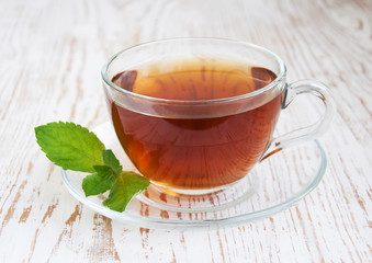 Teacup with mint leaves