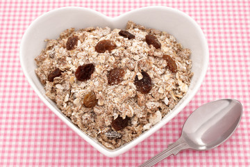 Muesli in a heart shaped bowl