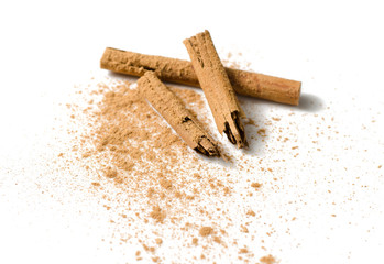 Cinnamon sticks and powder on white