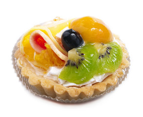 Sweet cakes with fruit on a white.